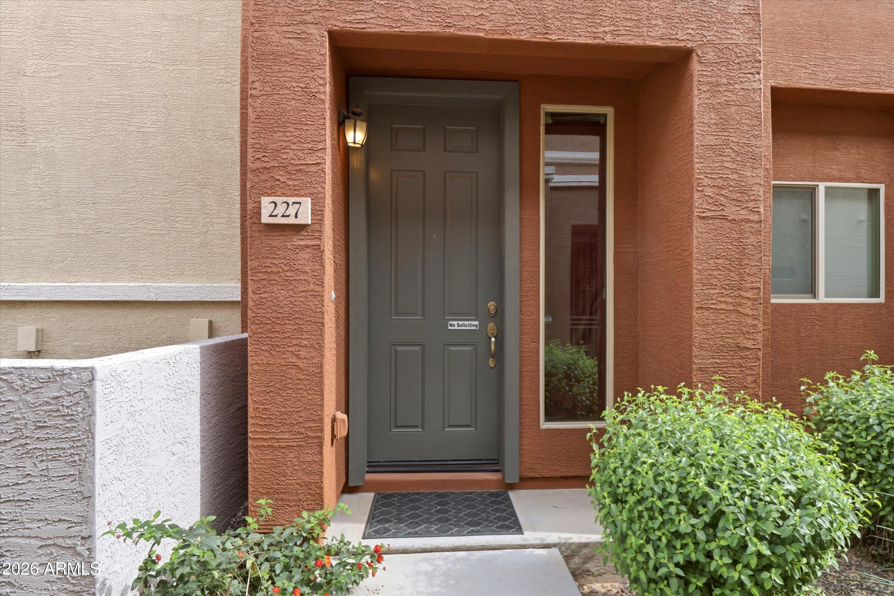 7726 East Baseline Road, Unit 227 Mesa, AZ 85209 - Photo 4 of 22 a front view of a house