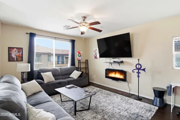 a living room with furniture and a flat screen tv
