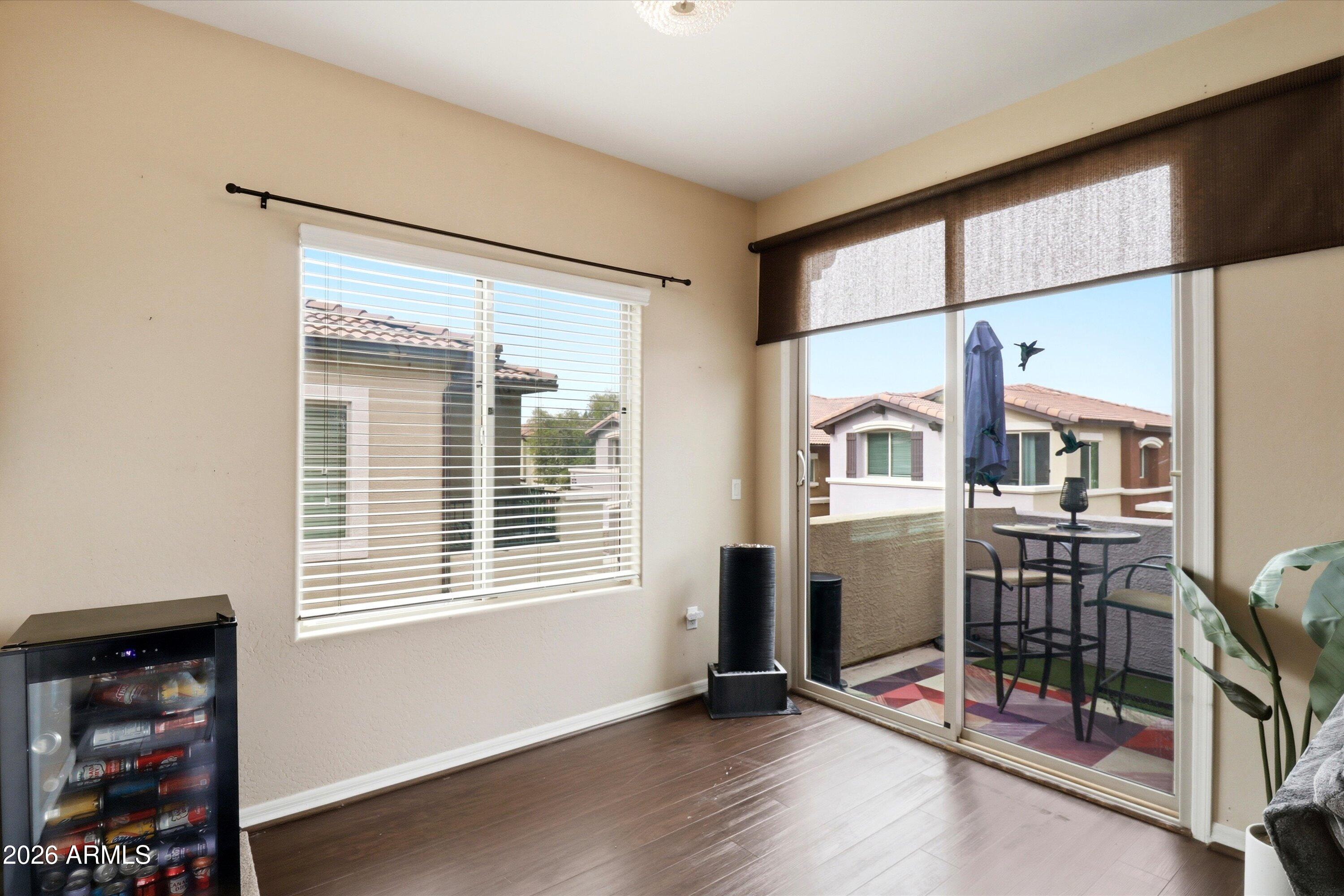7726 East Baseline Road, Unit 227 Mesa, AZ 85209 - Photo 8 of 22 a view of livingroom with furniture and windows