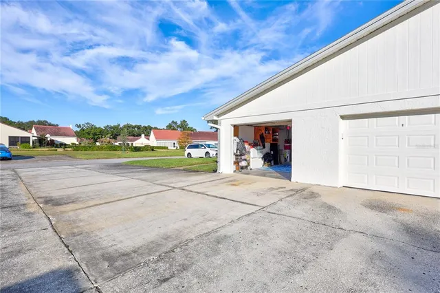 a view of a house with backyard porch and entertaining space