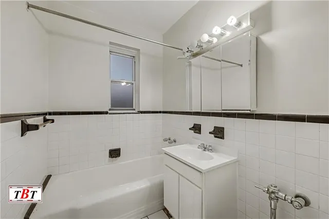 a bathroom with a shower and a glass door