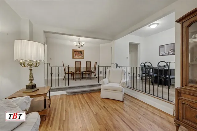 a view of a dining room that has a table and chairs in it