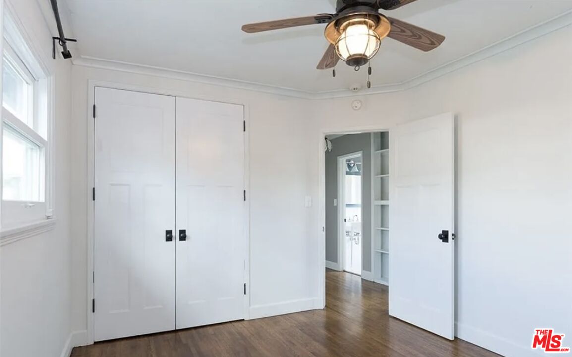7032 Trask Avenue Playa del Rey, CA 90293 - Photo 11 of 35 wooden floor in an empty room with a window