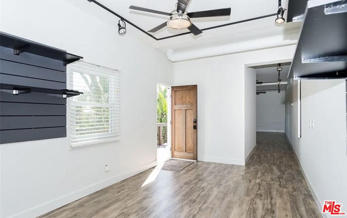 7032 Trask Avenue Playa del Rey, CA 90293 - Photo 20 of 35 a view of a hallway with wooden floor and staircase