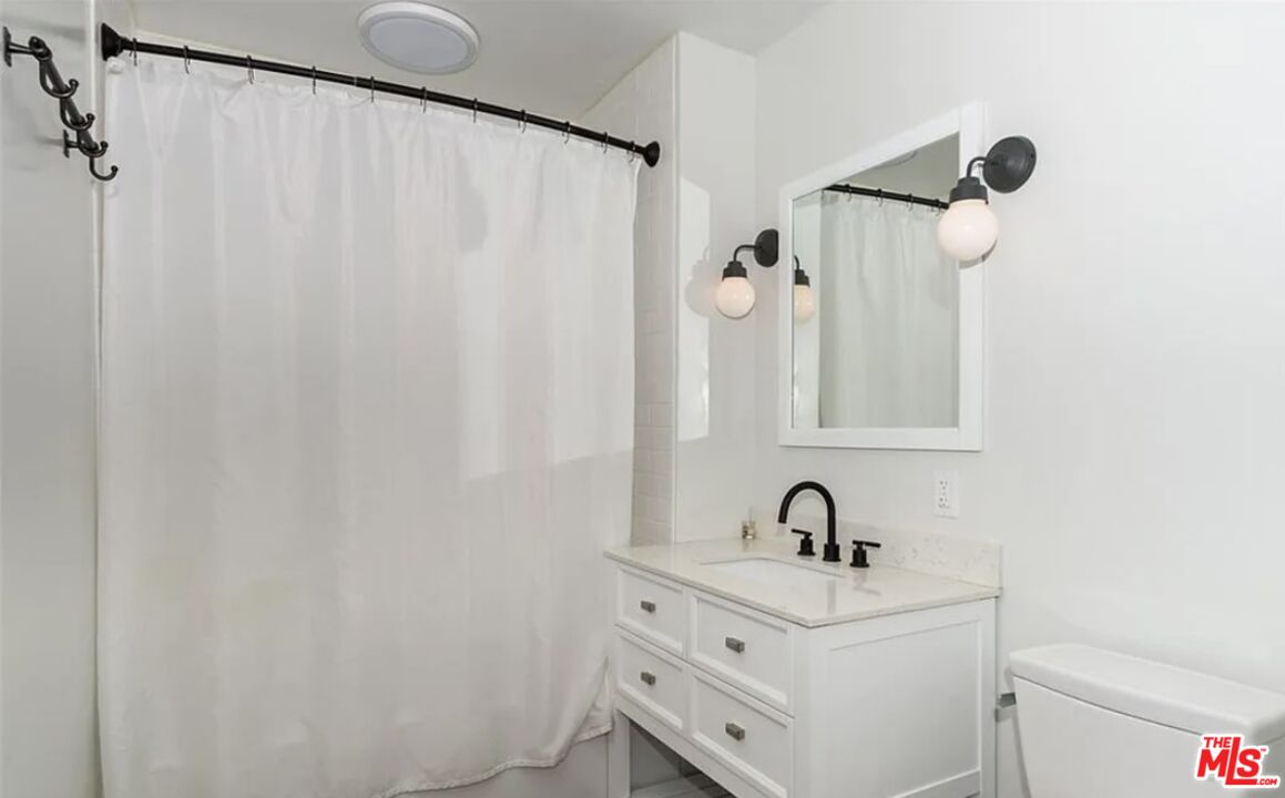 7032 Trask Avenue Playa del Rey, CA 90293 - Photo 22 of 35 a bathroom with a sink and a mirror