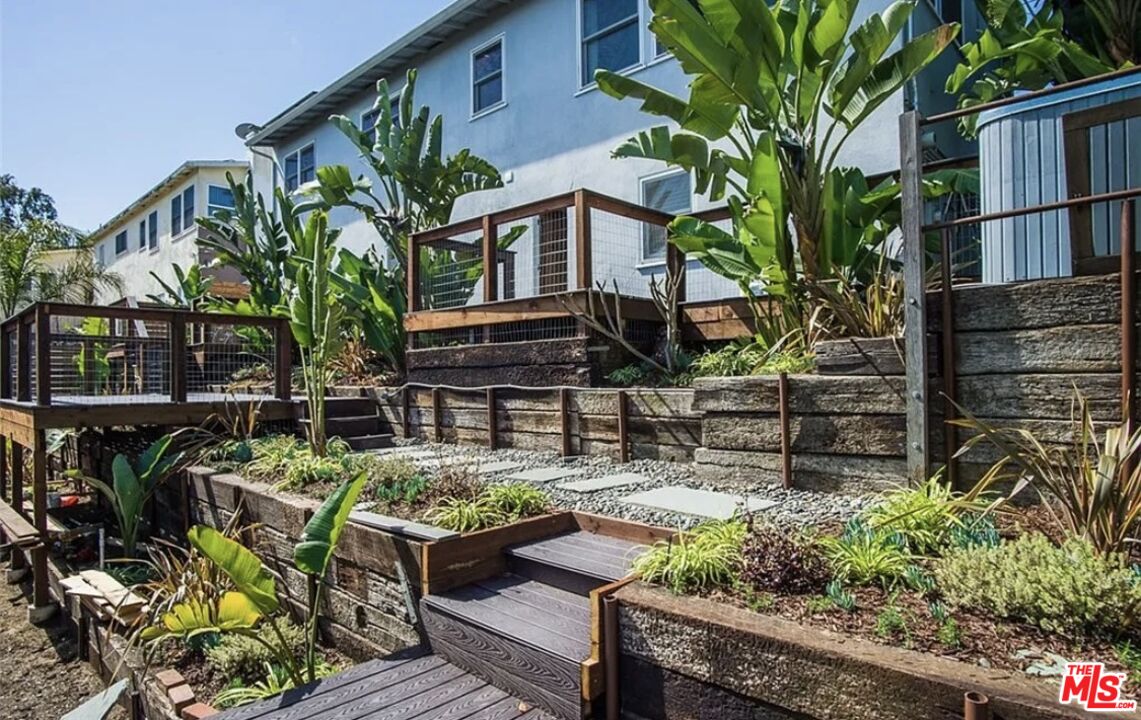 7032 Trask Avenue Playa del Rey, CA 90293 - Photo 23 of 35 a view of a chairs and table in a backyard