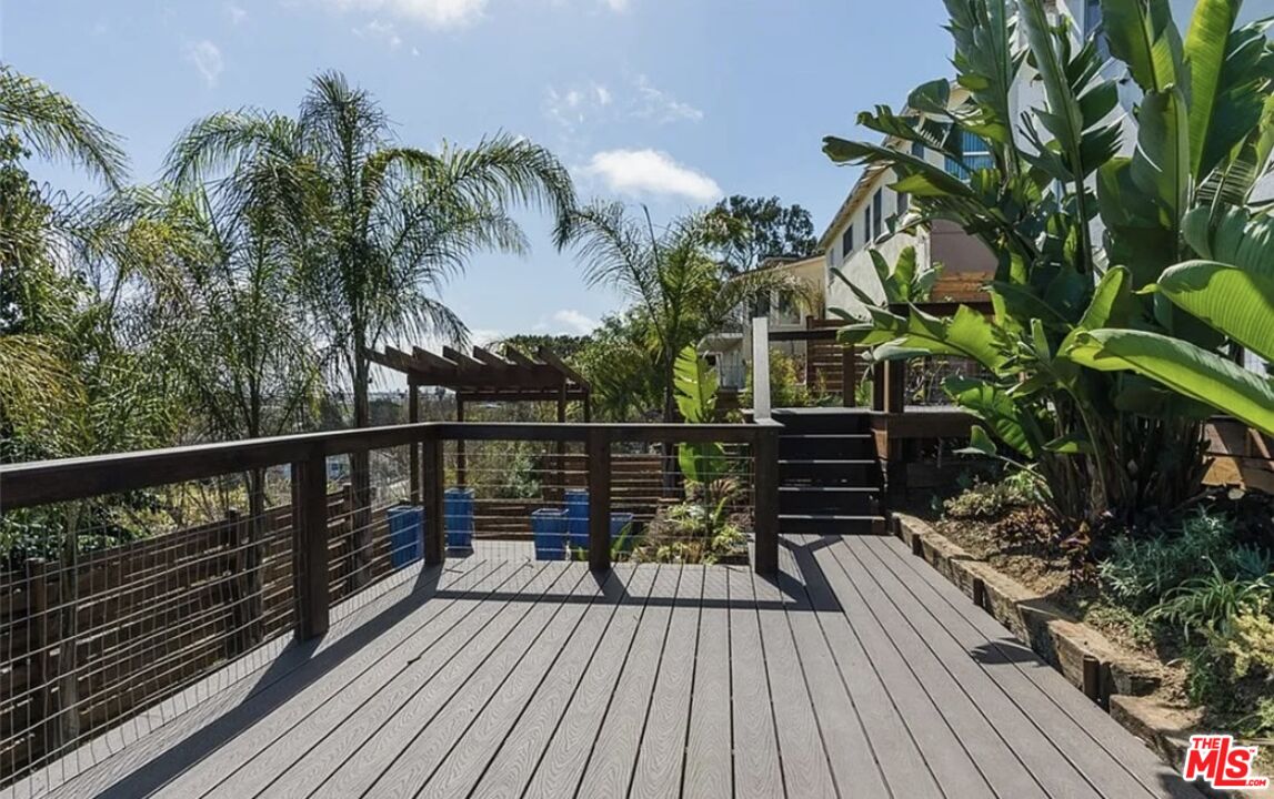 7032 Trask Avenue Playa del Rey, CA 90293 - Photo 24 of 35 a view of balcony with wooden floor and potted plant