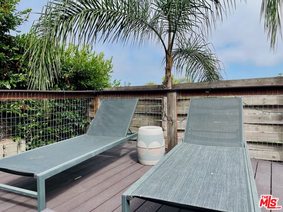 7032 Trask Avenue Playa del Rey, CA 90293 - Photo 31 of 35 a view of a balcony with wooden floor and potted plant