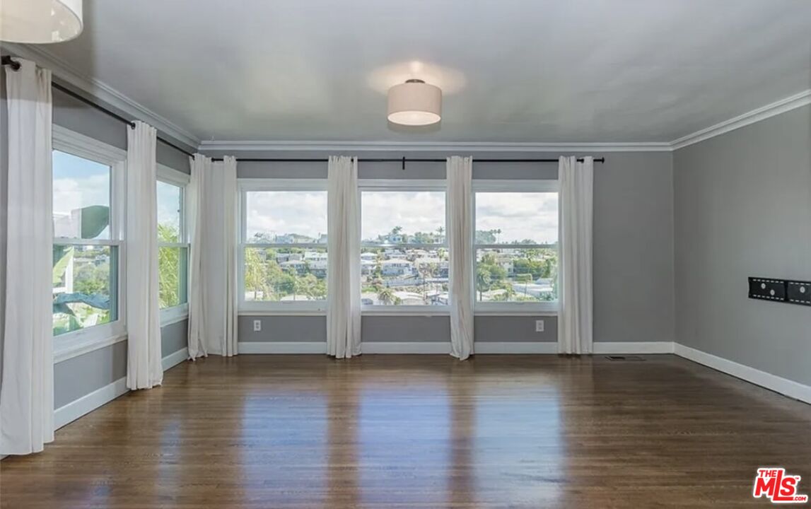7032 Trask Avenue Playa del Rey, CA 90293 - Photo 5 of 35 a view of room with window and wooden floor