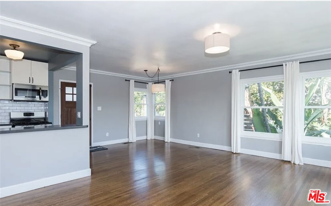 7032 Trask Avenue Playa del Rey, CA 90293 - Photo 7 of 35 a view of a kitchen with wooden floor and a window