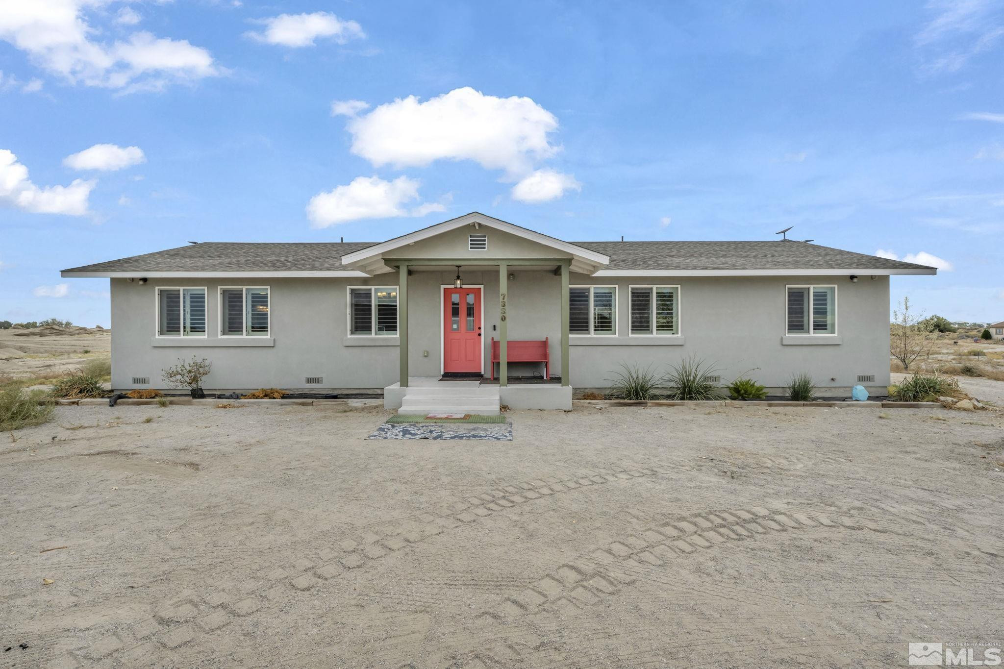 7330 Sandhill Road Fallon, NV 89406 - Photo 1 of 39 a view of a house with a patio