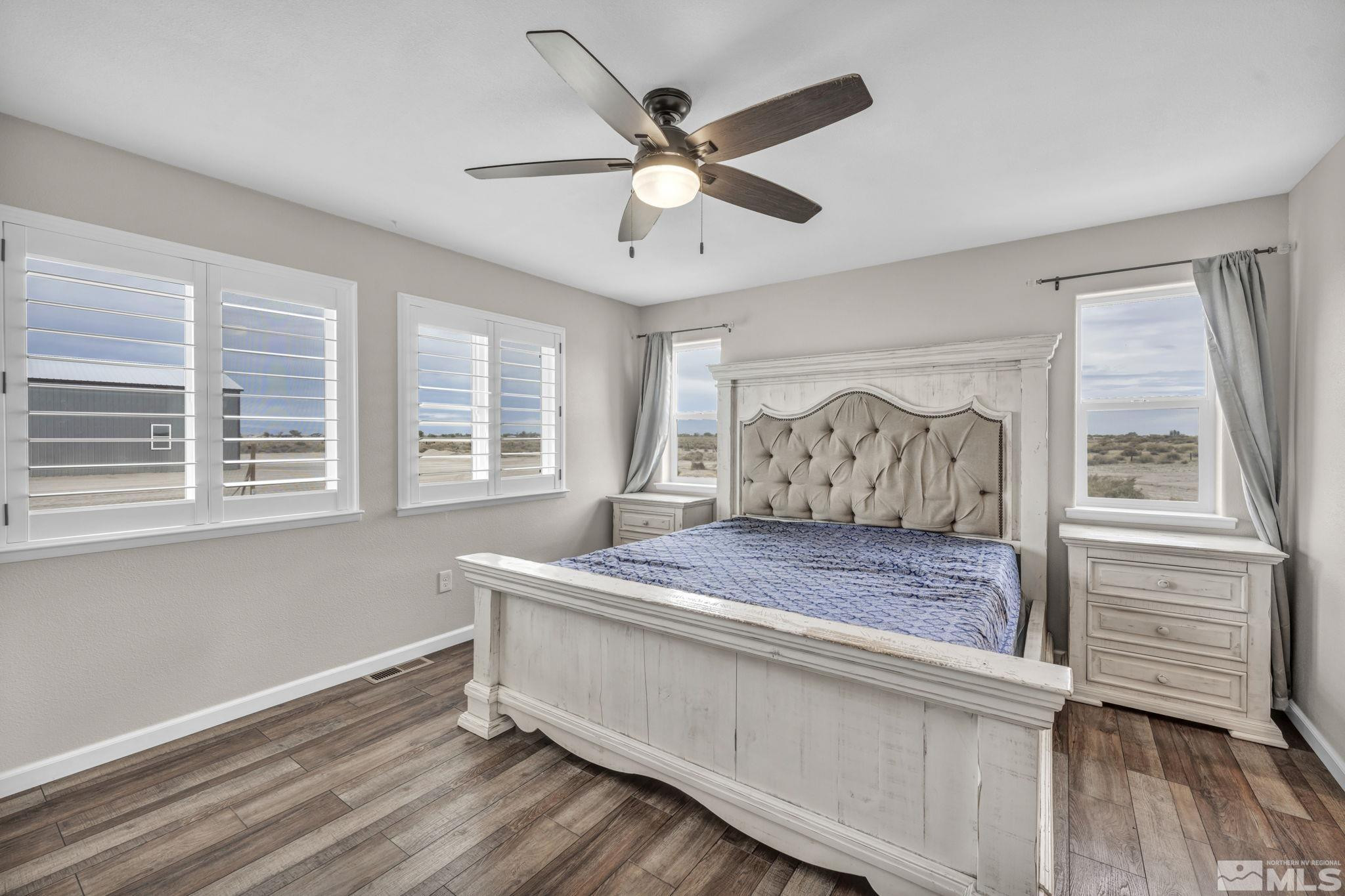 7330 Sandhill Road Fallon, NV 89406 - Photo 13 of 39 a bedroom with a bed and window