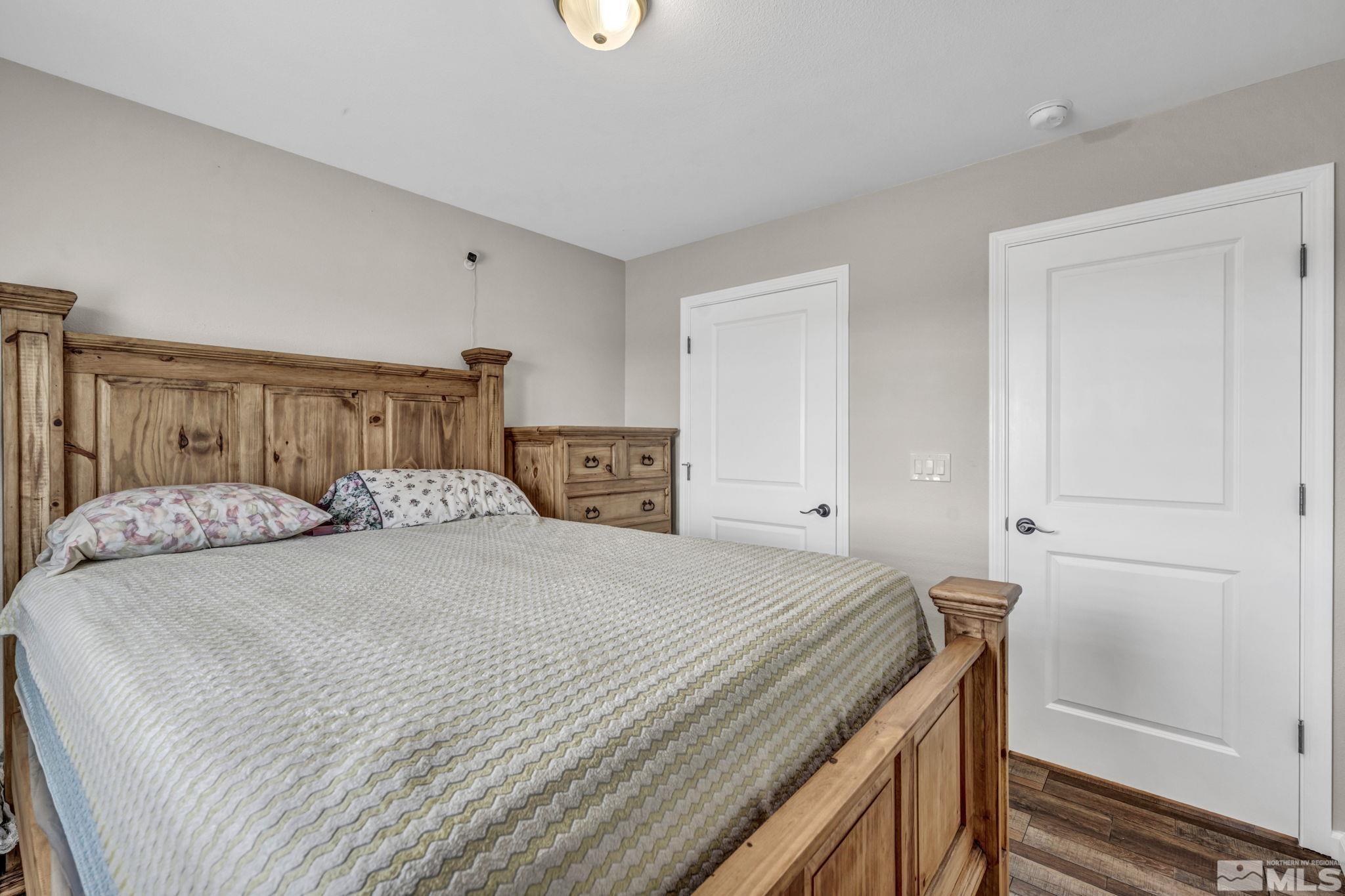7330 Sandhill Road Fallon, NV 89406 - Photo 21 of 39 a bedroom with a bed and a window
