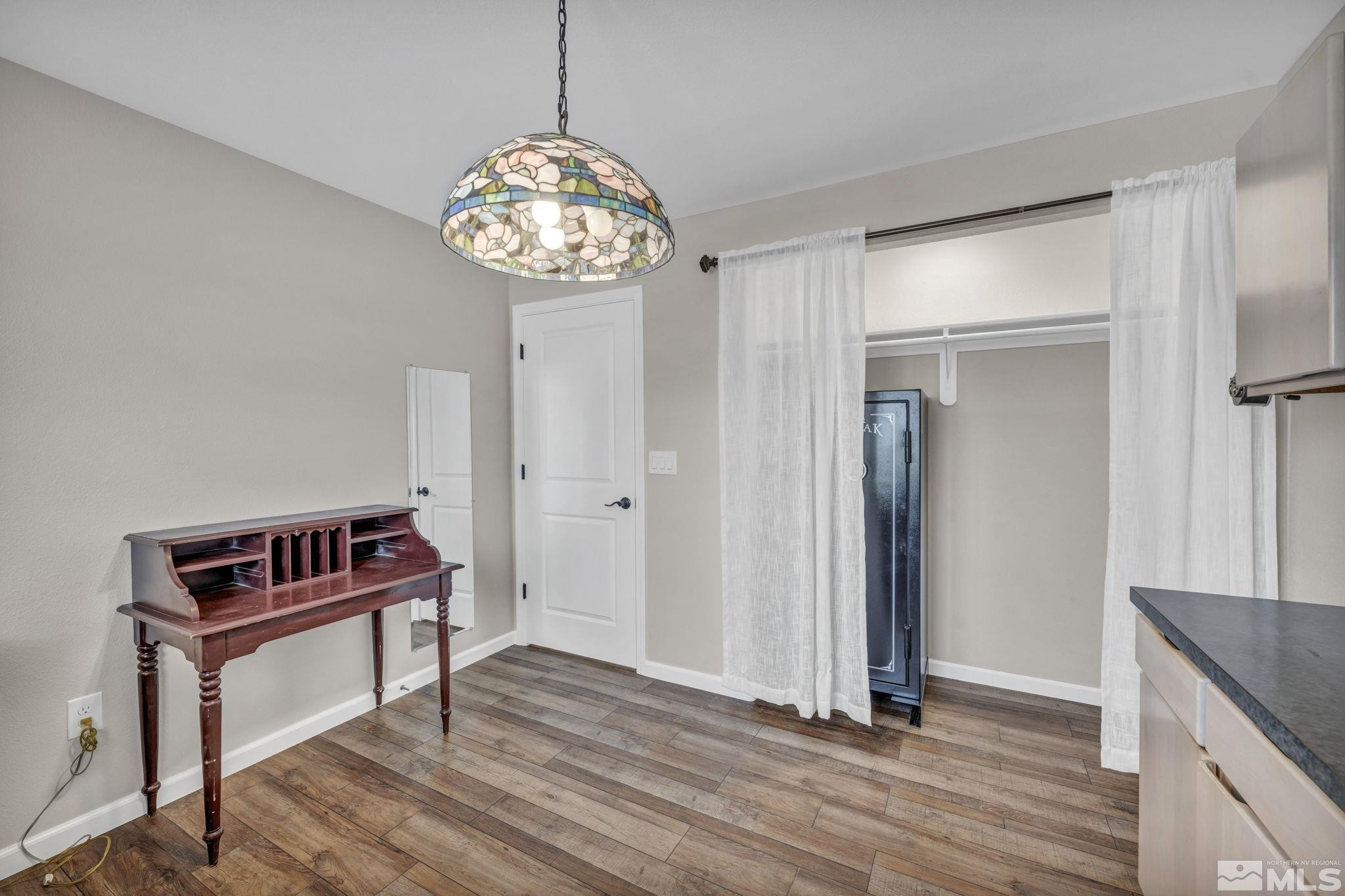7330 Sandhill Road Fallon, NV 89406 - Photo 24 of 39 a view of a hallway with a chandelier