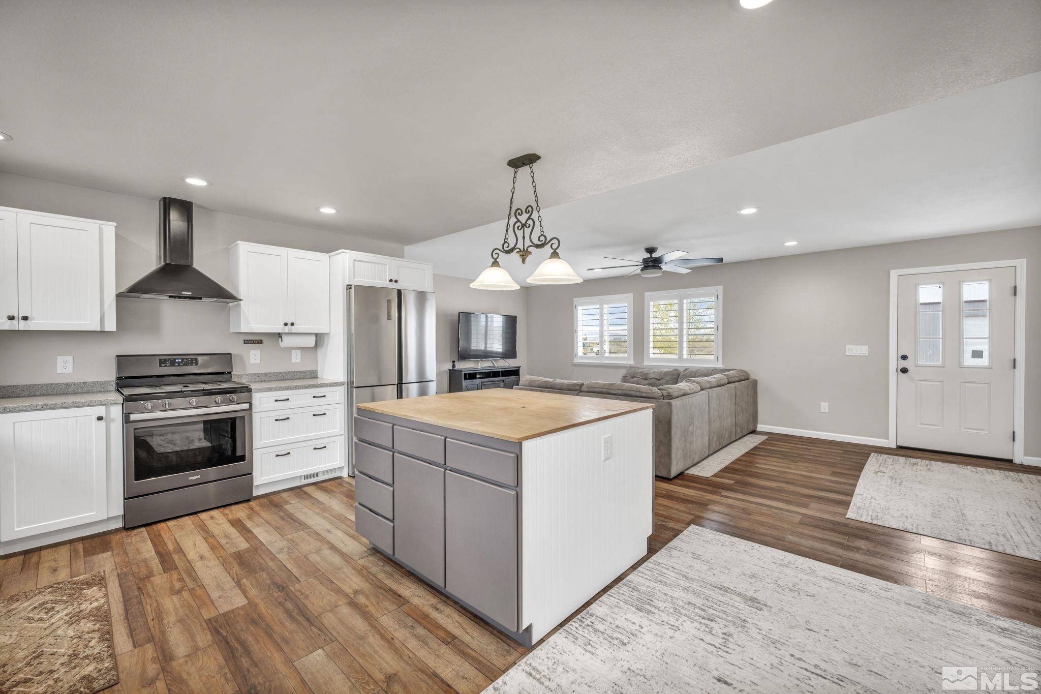 7330 Sandhill Road Fallon, NV 89406 - Photo 7 of 39 a kitchen with granite countertop a stove and a sink