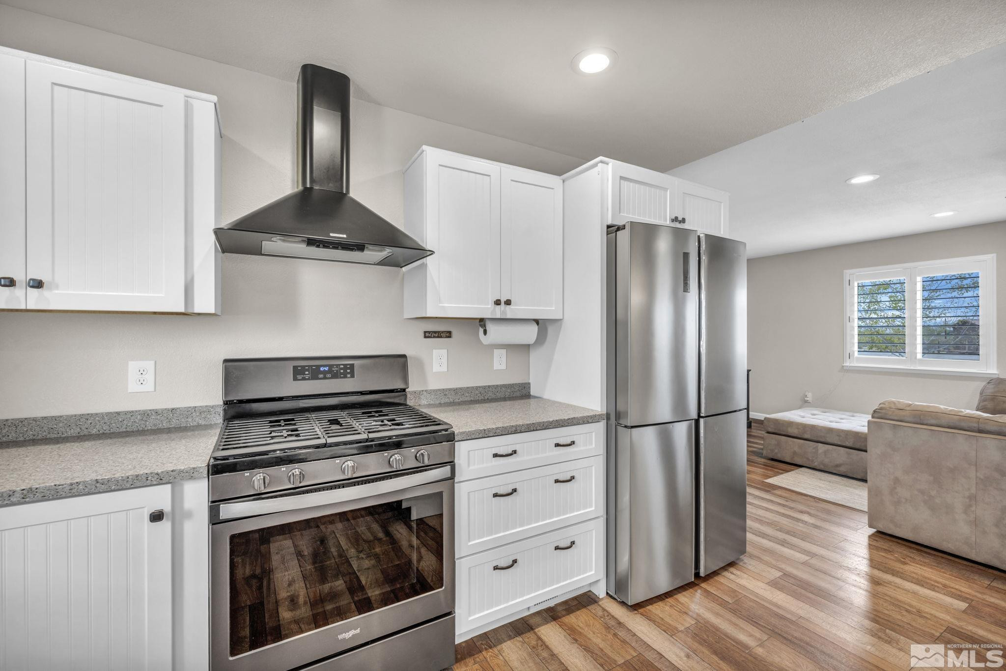 7330 Sandhill Road Fallon, NV 89406 - Photo 8 of 39 a kitchen with stainless steel appliances a stove a refrigerator and cabinets