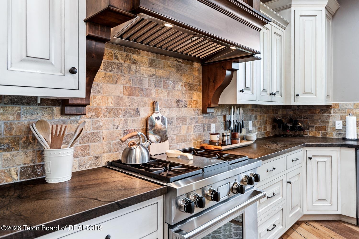29 White Point Road Cora, WY 82925 - Photo 25 of 102 Wolf gas range and stone backsplash