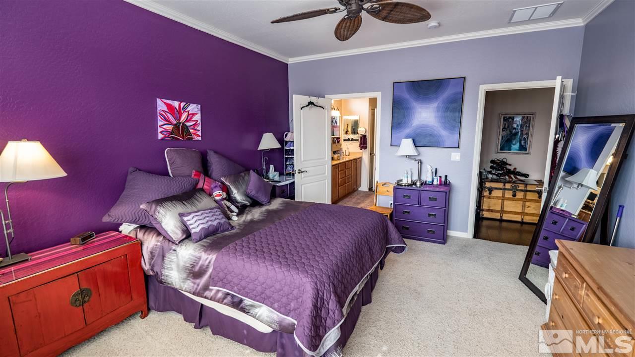 1295 Tarleton Way Reno, NV 89523 - Photo 12 of 23 a bed room with a bed and a lamp