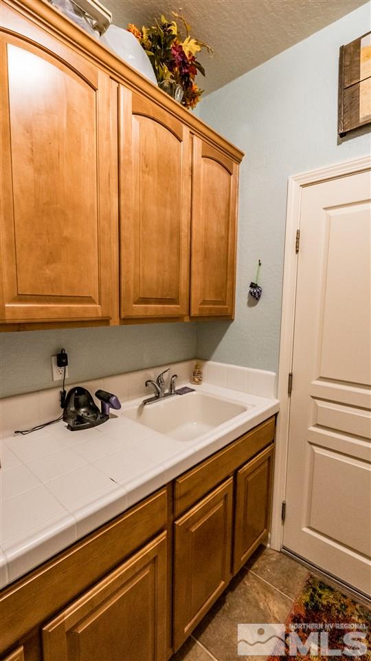 1295 Tarleton Way Reno, NV 89523 - Photo 17 of 23 a room with a sink and cabinets