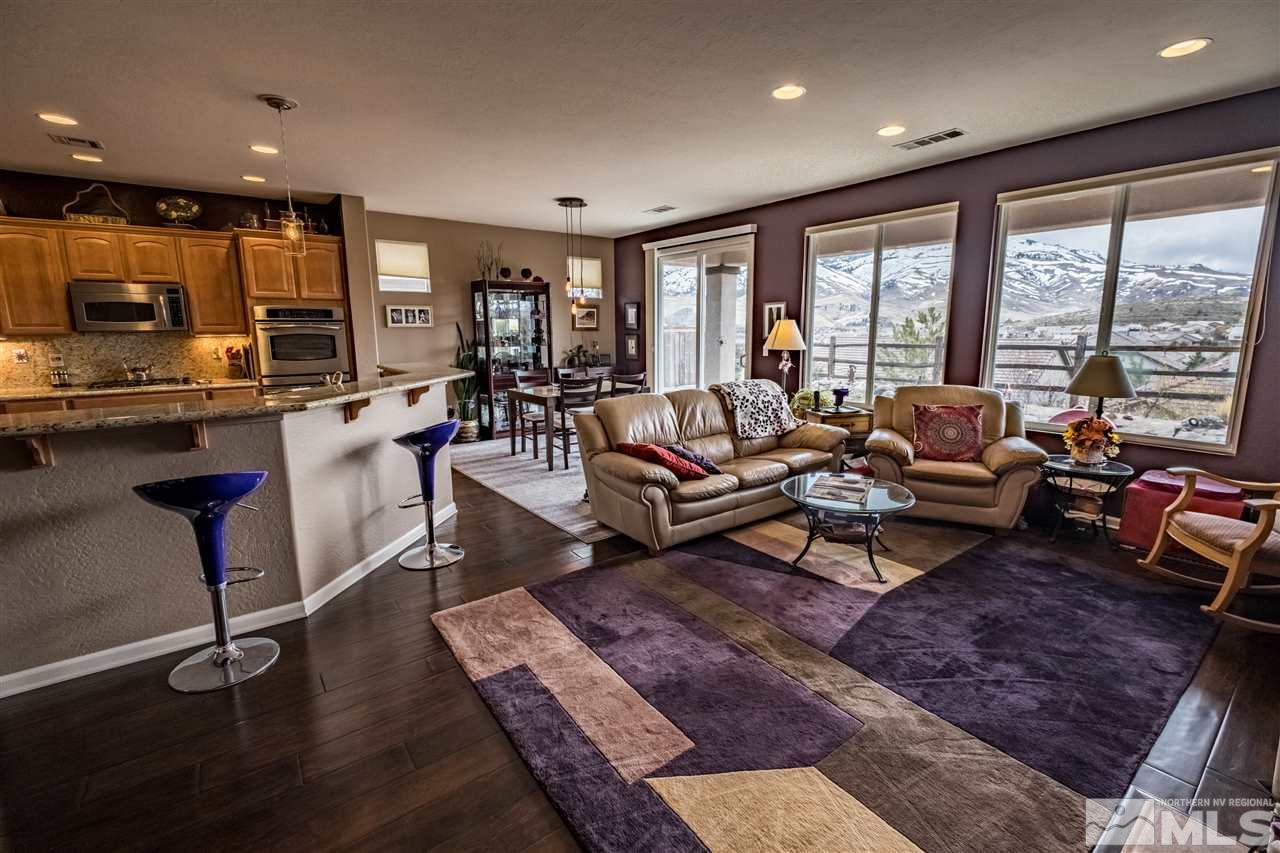 1295 Tarleton Way Reno, NV 89523 - Photo 8 of 23 a living room with furniture a rug and a large window