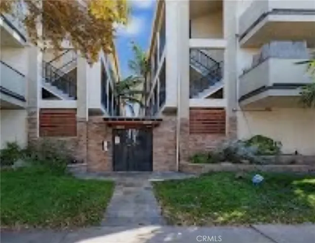a view of a house with a yard and plants
