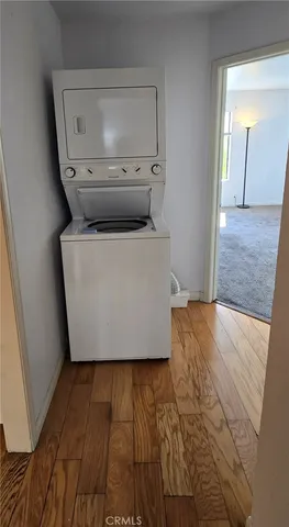 a room with wooden floor and cabinet