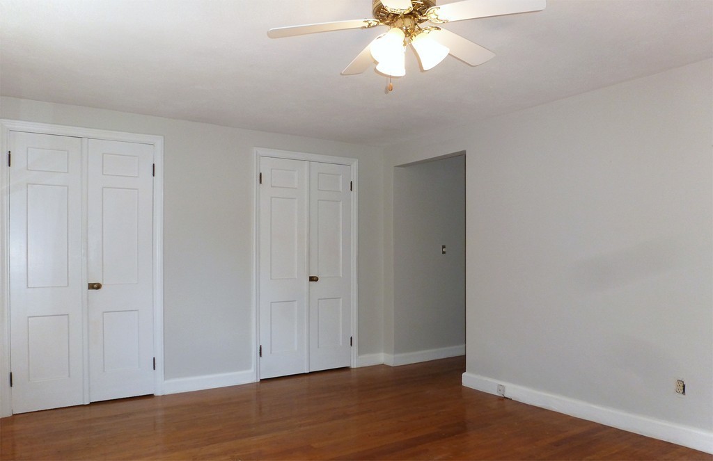 1343 Bradley Road Springfield, MA 01118 - Photo 11 of 24 a view of an empty room with wooden floor