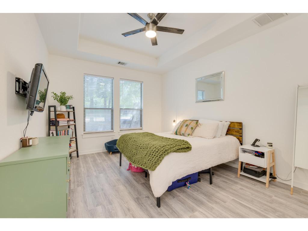 2001 Faro Drive, Unit 53 Austin, TX 78741 - Photo 18 of 34 a living room with furniture and a flat screen tv