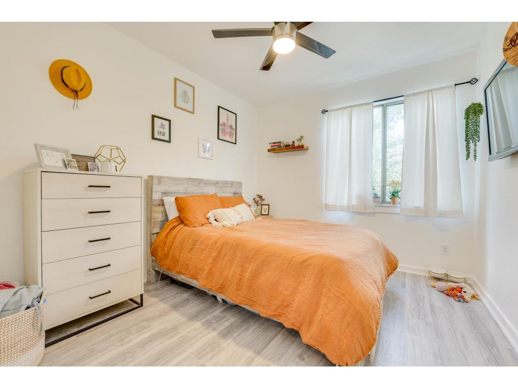 2001 Faro Drive, Unit 53 Austin, TX 78741 - Photo 27 of 34 a bedroom with a bed and a window