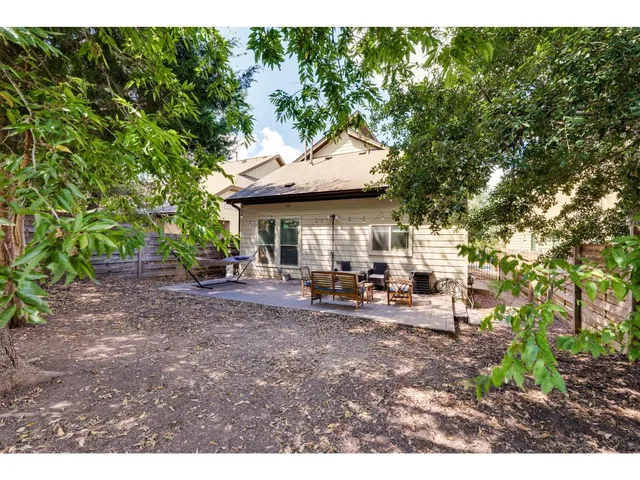 a view of a house with sitting area and garden