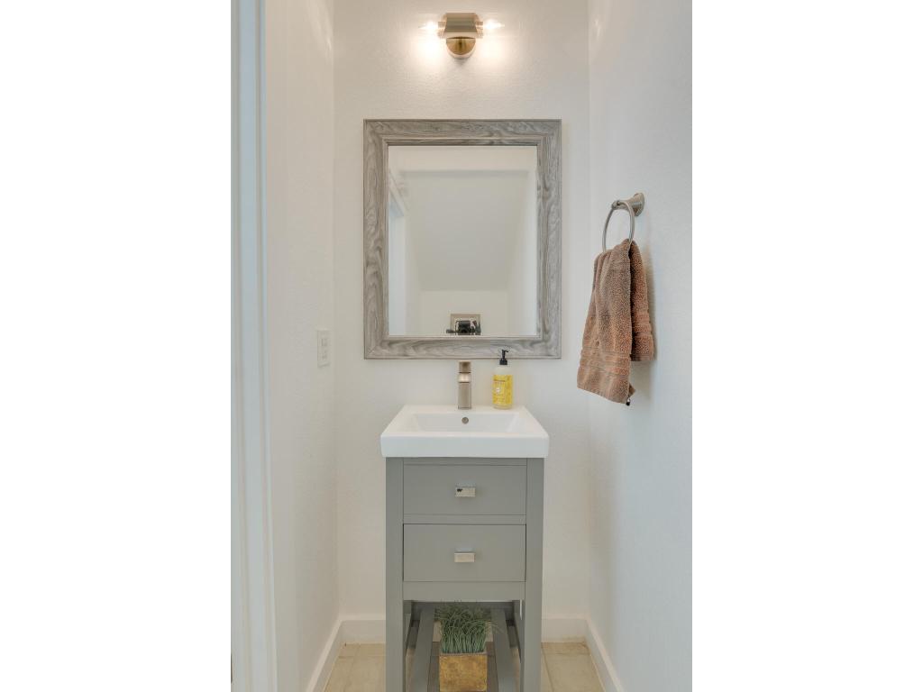 2001 Faro Drive, Unit 53 Austin, TX 78741 - Photo 8 of 34 a bathroom with a sink and a mirror