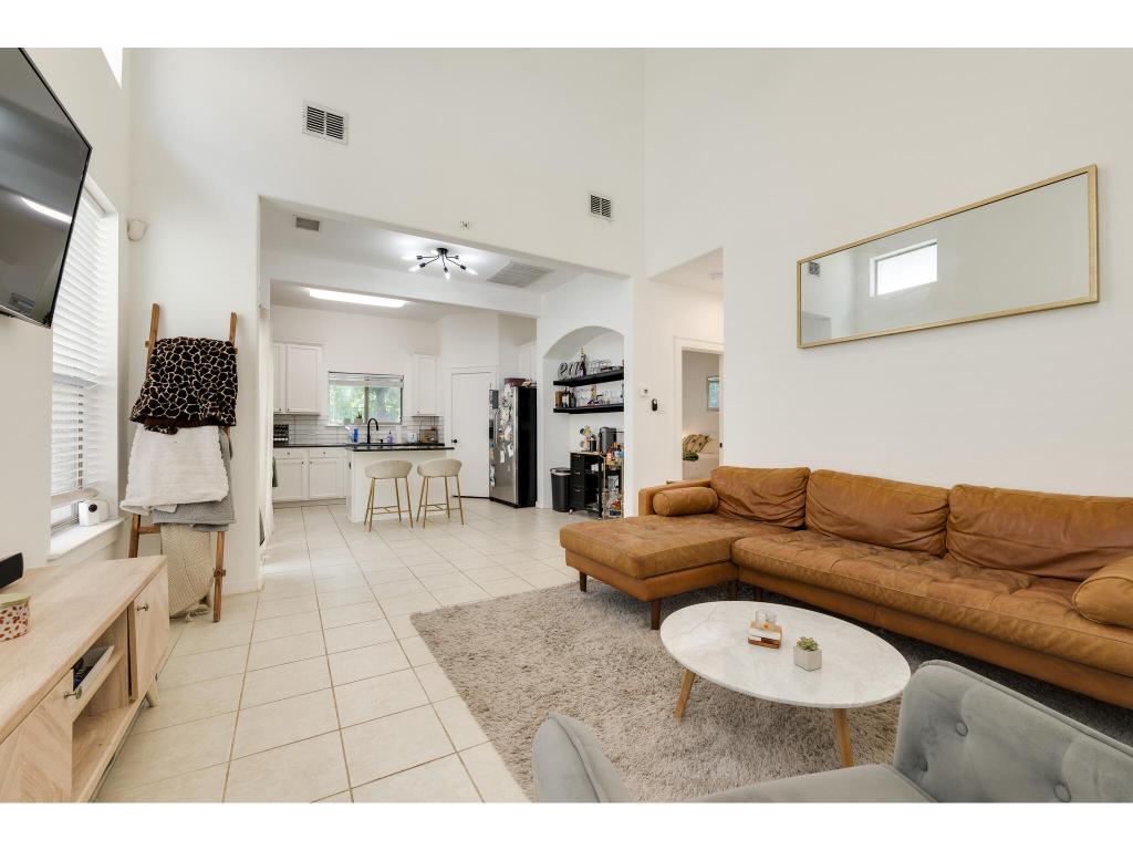 2001 Faro Drive, Unit 53 Austin, TX 78741 - Photo 9 of 34 a living room with furniture and a flat screen tv