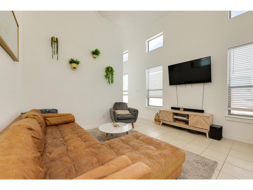 2001 Faro Drive, Unit 53 Austin, TX 78741 - Photo 10 of 34 a living room with furniture and a flat screen tv