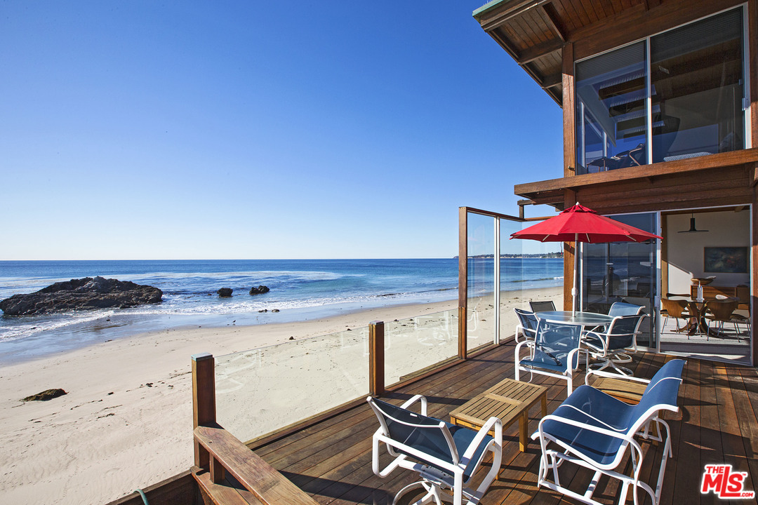 24958 Malibu Road Malibu, CA 90265 - Photo 14 of 50 a view of a patio with wooden chairs