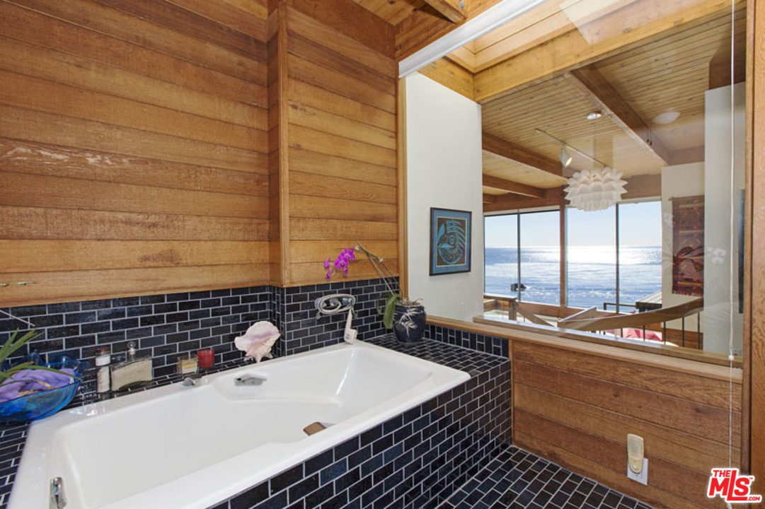 24958 Malibu Road Malibu, CA 90265 - Photo 34 of 50 a bathroom with a sink and a bathtub