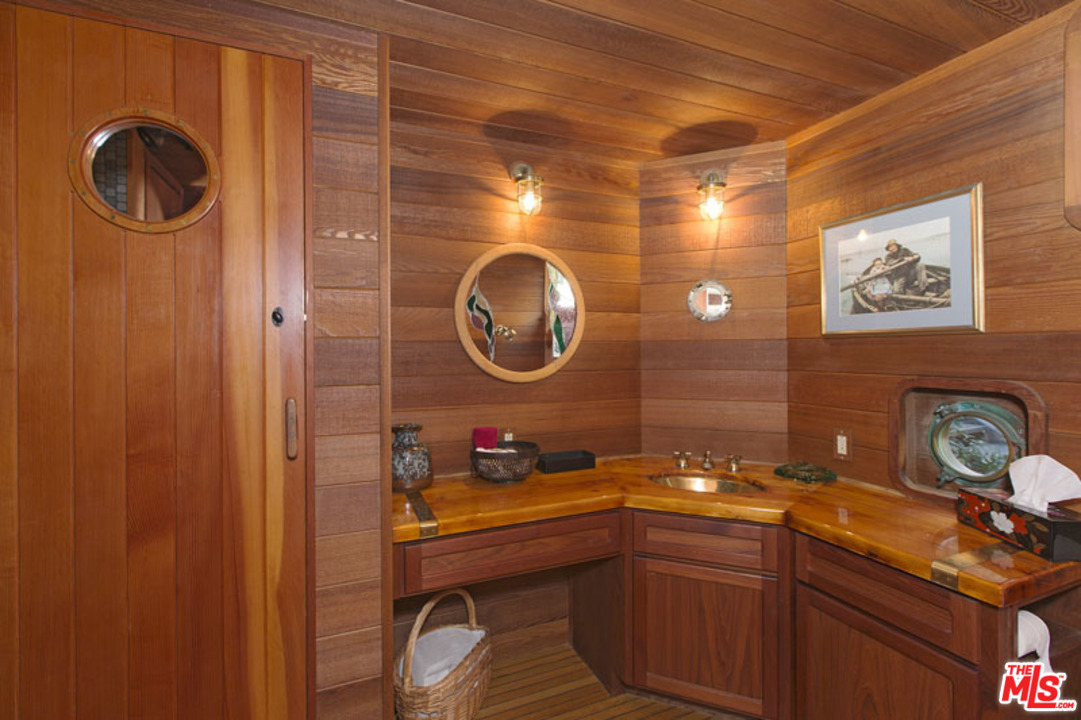 24958 Malibu Road Malibu, CA 90265 - Photo 40 of 50 a bathroom with a sink and a mirror
