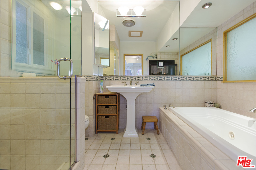 24958 Malibu Road Malibu, CA 90265 - Photo 48 of 50 a bathroom with a tub sink and mirror