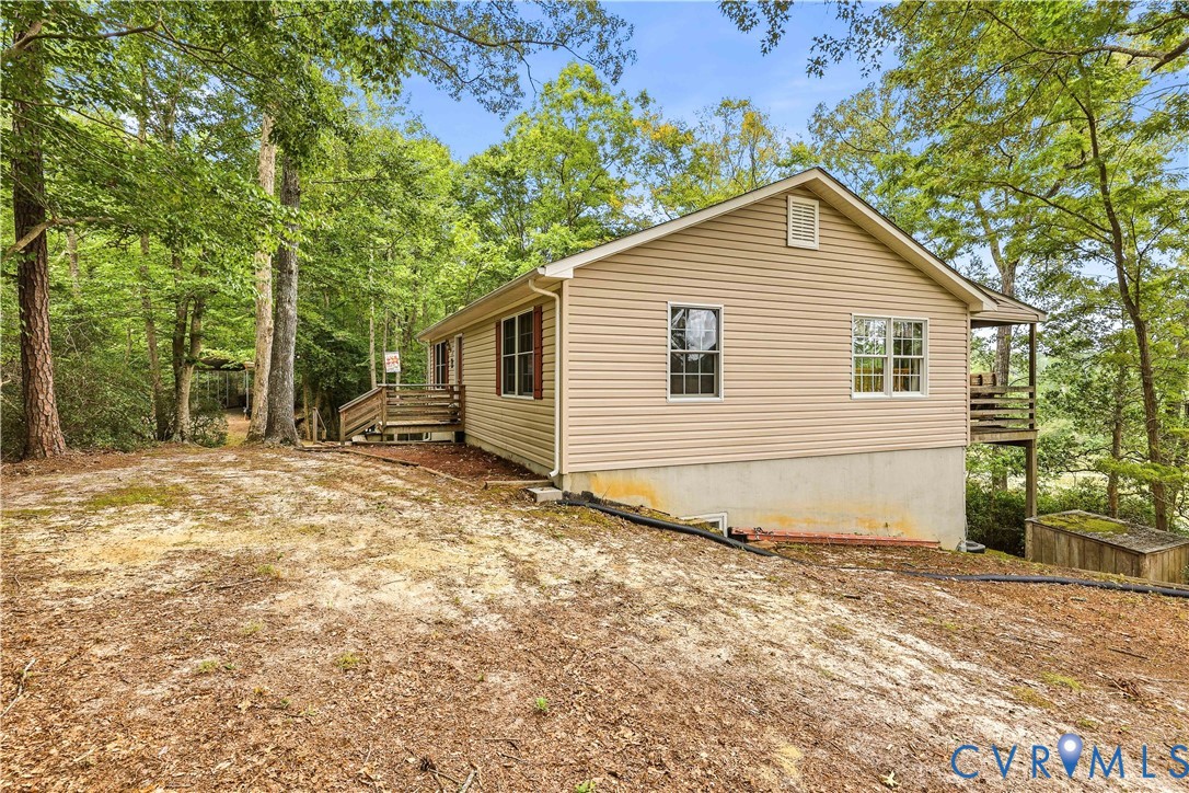 471 Knights Run Road Heathsville, VA 22473 - Photo 33 of 36 Tan horizontal siding exterior with a gable roofli