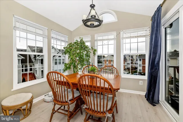 a view of a chairs and table in the balcony