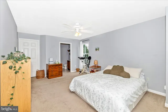 a bedroom with furniture and a flat tv screen