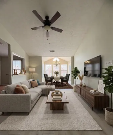 a spacious bedroom with a bed a couch and dresser