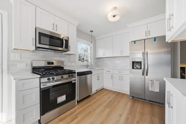 a view of kitchen with wooden floor