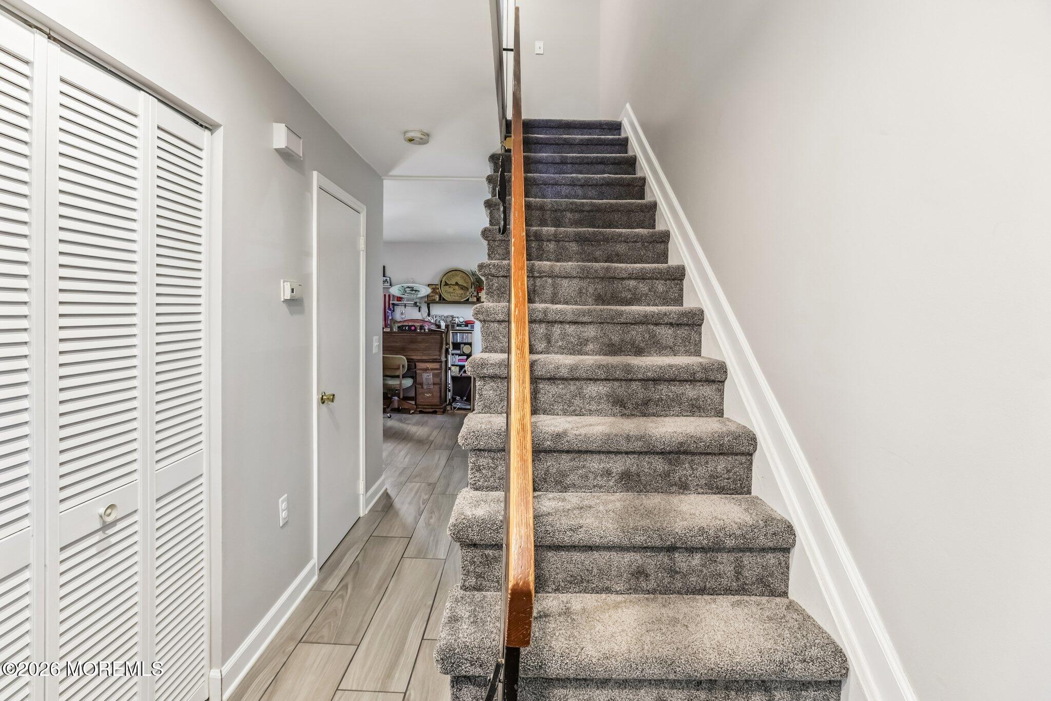 197 Azalea Circle Jackson, NJ 08527 - Photo 24 of 33 a view of a hallway with wooden floor and entryway