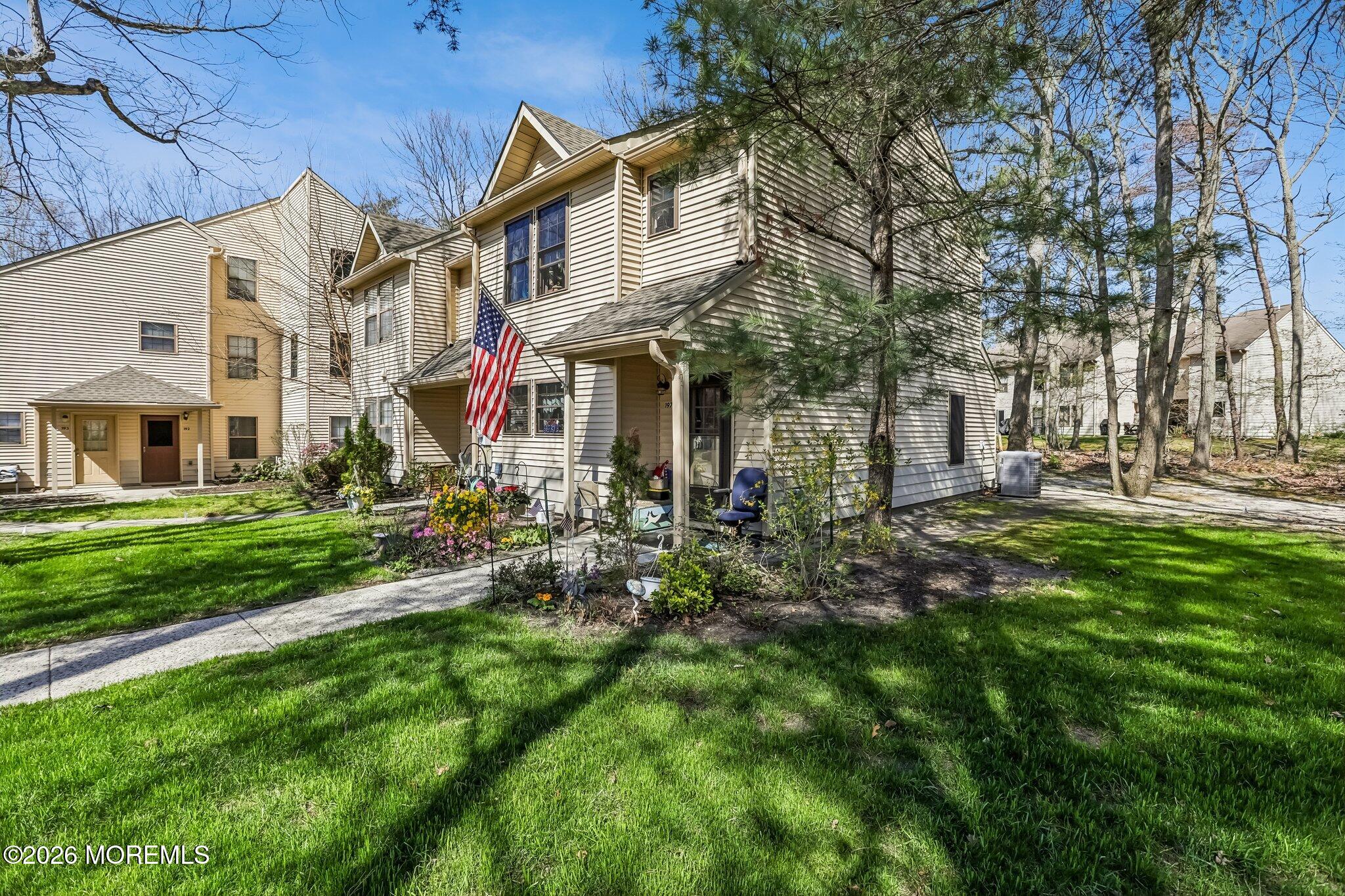 197 Azalea Circle Jackson, NJ 08527 - Photo 4 of 33 a view of a building with a yard