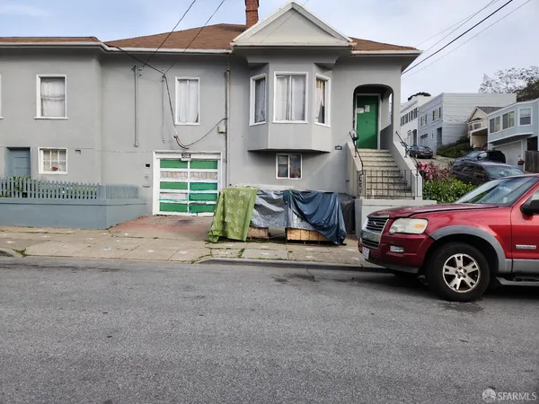 a car parked in front of a house