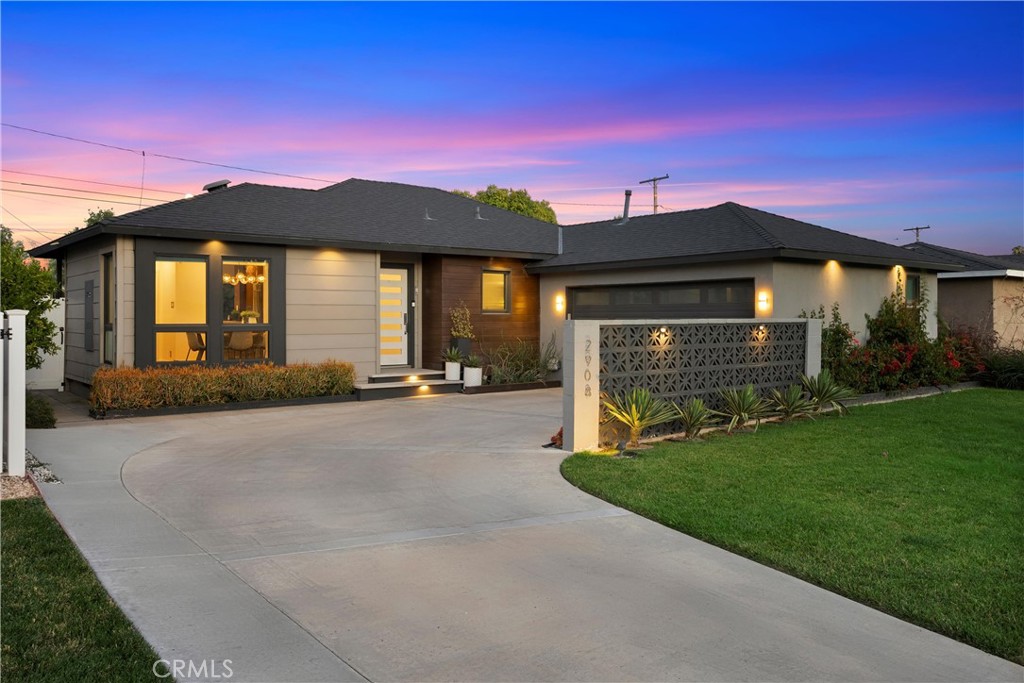 2908 Foreman Avenue Long Beach, CA 90815 - Photo 35 of 37 a front view of a house with a yard and garage