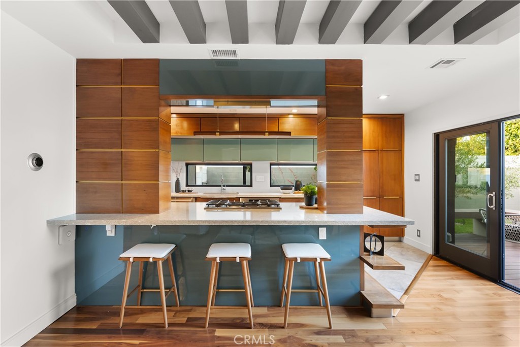 2908 Foreman Avenue Long Beach, CA 90815 - Photo 6 of 37 a kitchen with a sink and chairs