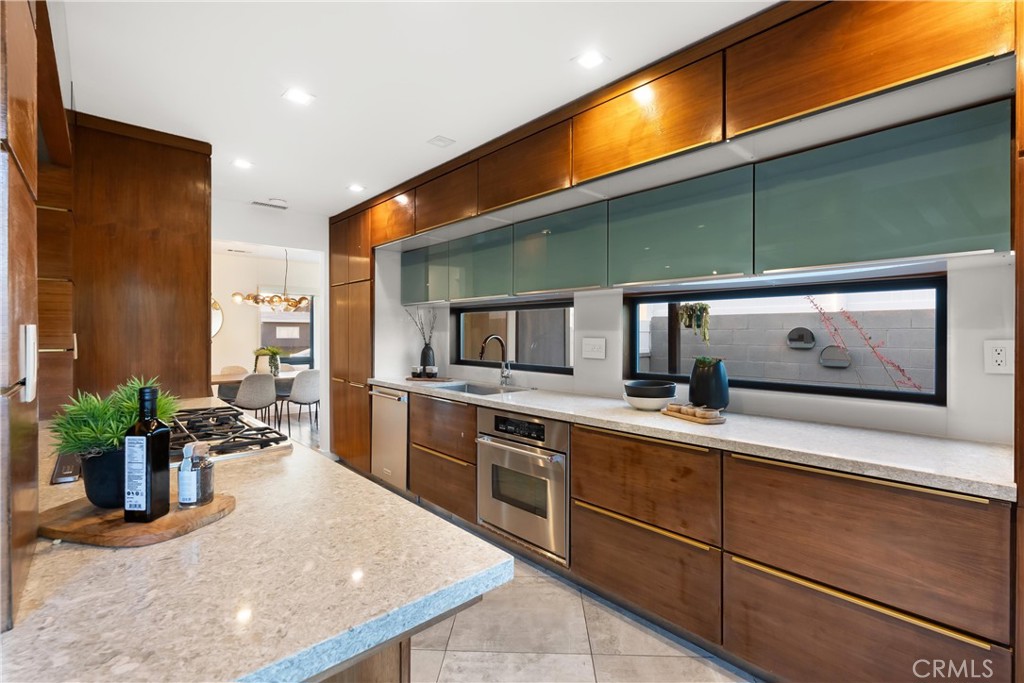 2908 Foreman Avenue Long Beach, CA 90815 - Photo 8 of 37 a kitchen with a sink and cabinets