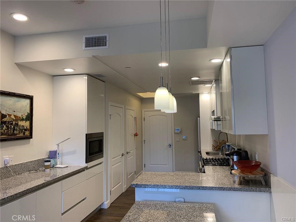 28 North 3rd Street, Unit B210 Alhambra, CA 91801 - Photo 7 of 9 a spacious bathroom with a sink a mirror and a shower