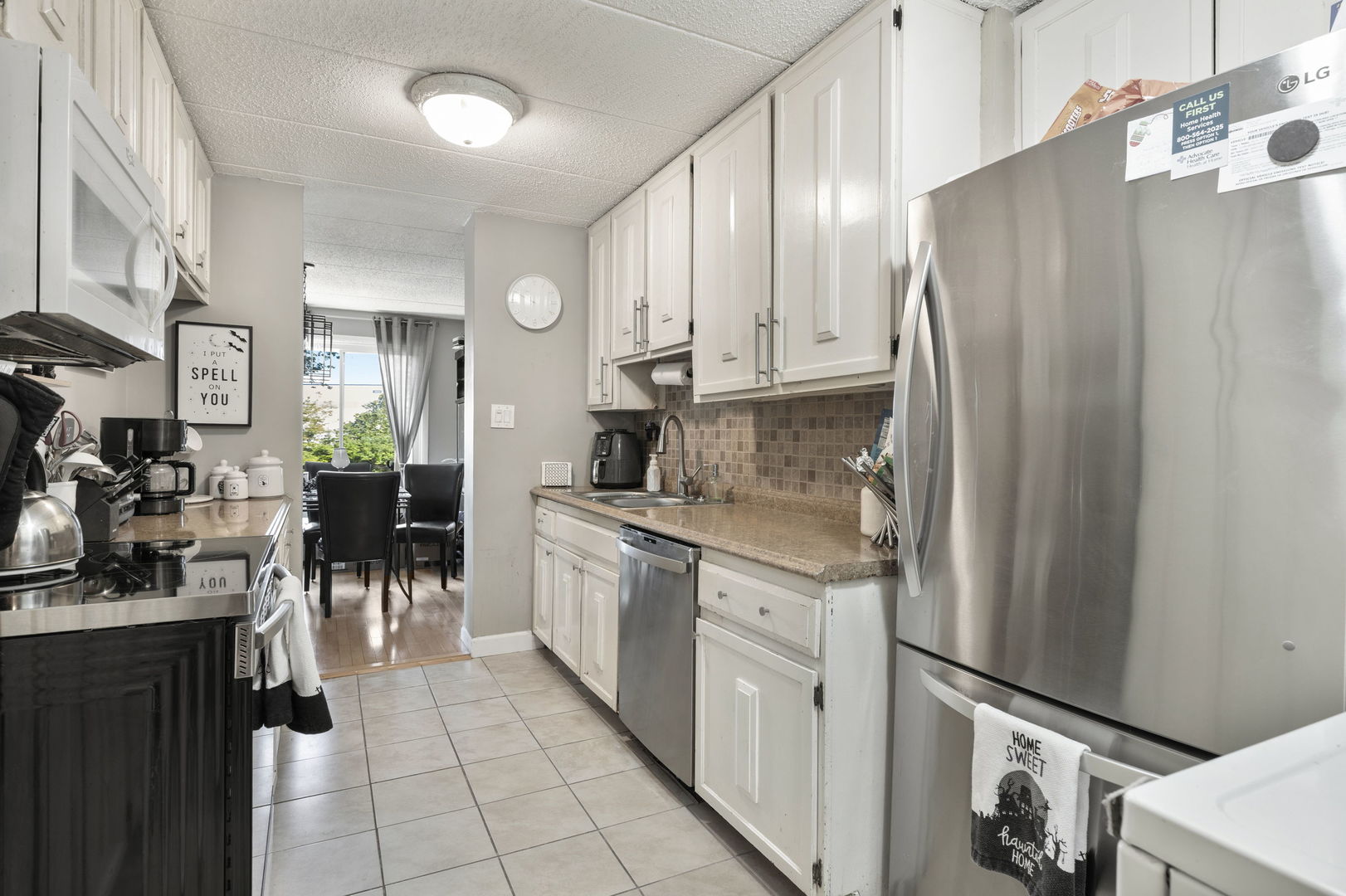 18 East Old Willow Road, Unit 210N Prospect Heights, IL 60070 - Photo 12 of 18 a kitchen with stainless steel appliances granite countertop a refrigerator and a stove